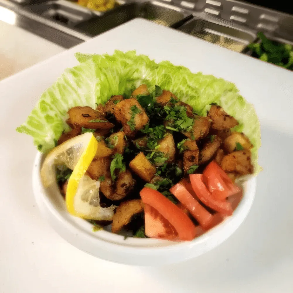 Batata harrah — crisp potato cubes with herbs, lemon and tomato