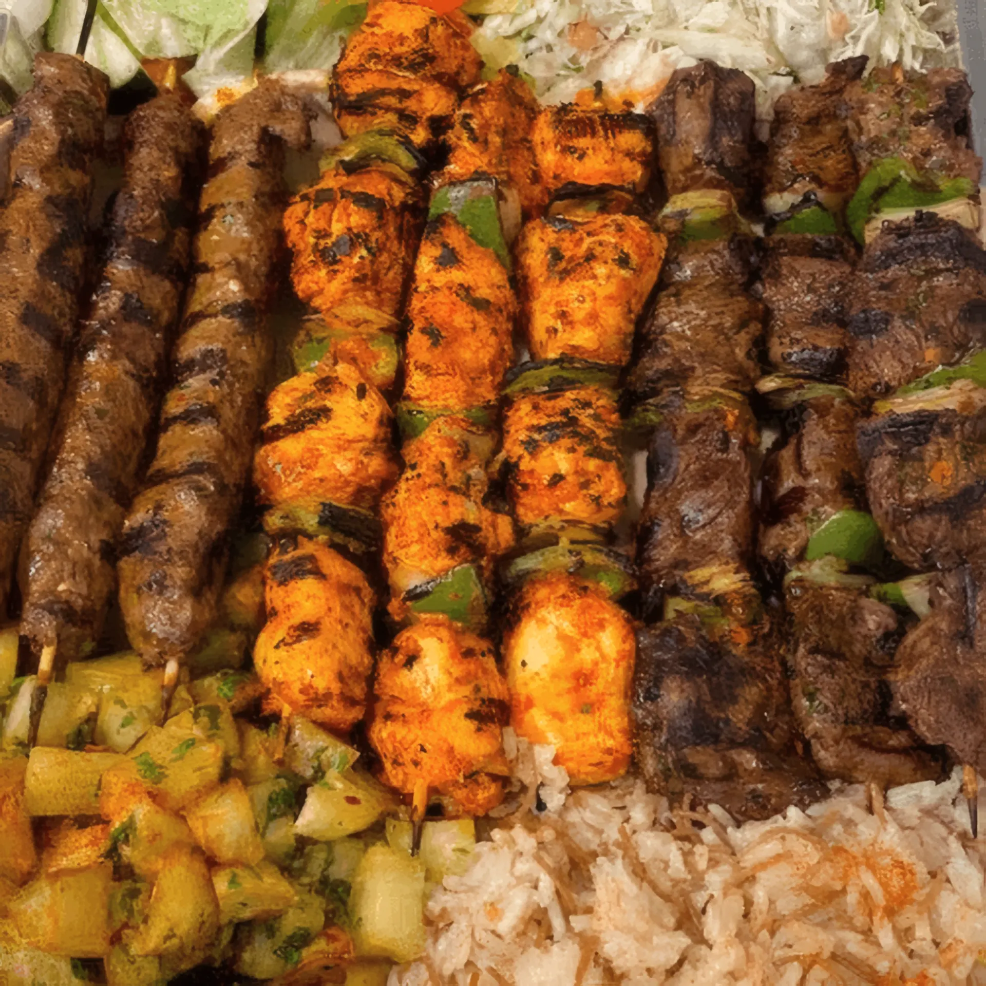 Lily's family mixed grill platter — skewers, rice and grilled vegetables