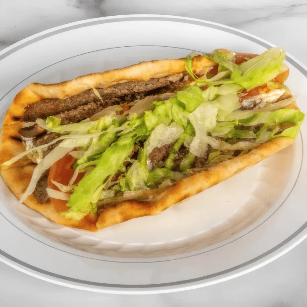 Lamb and beef gyro wrap on grilled pita