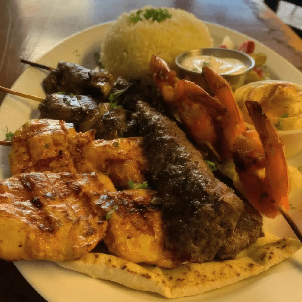 Lily's mixed grill platter with skewers, shrimp and rice